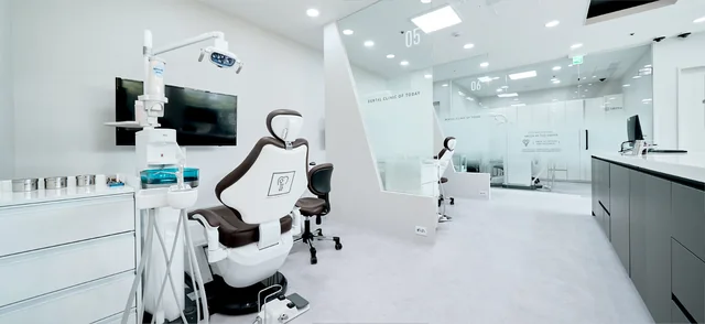 An unoccupied dental chair with its light and surrounding workspace at Today Dental.