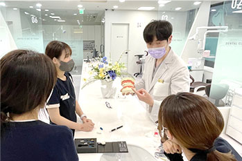 The clinical team going over case models together at the clinic.